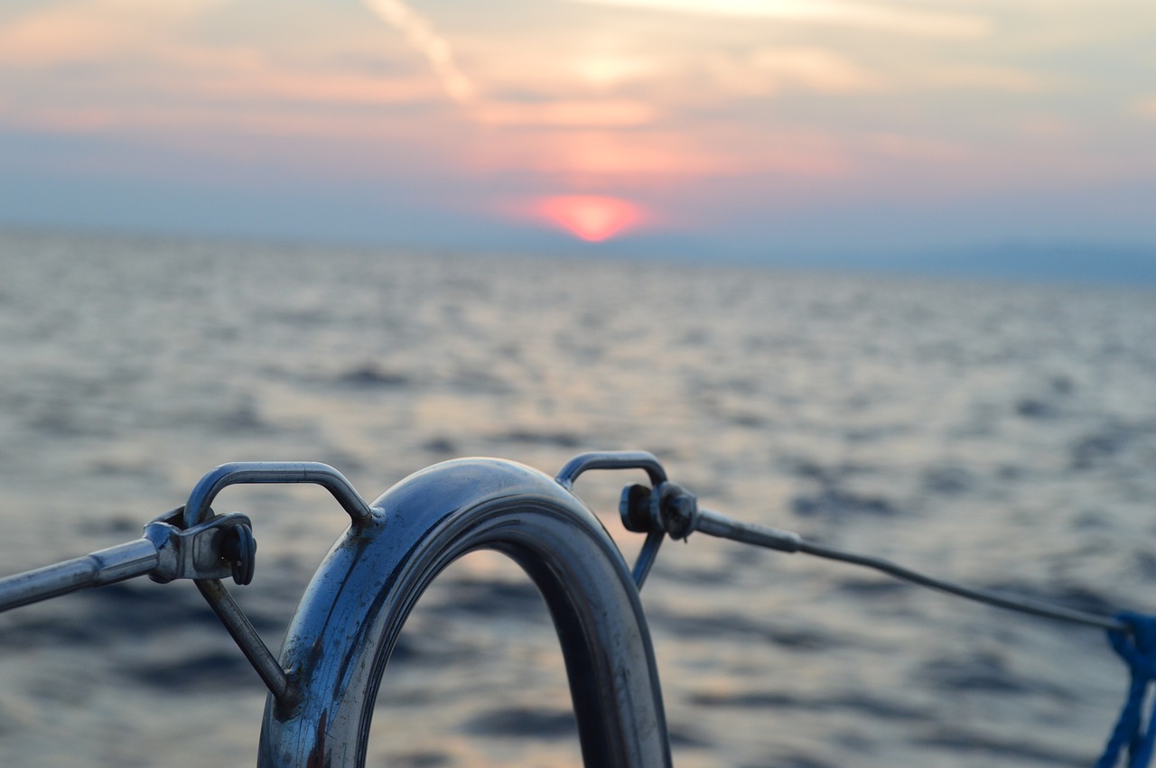 sunset  sailing vessel  sea free photo