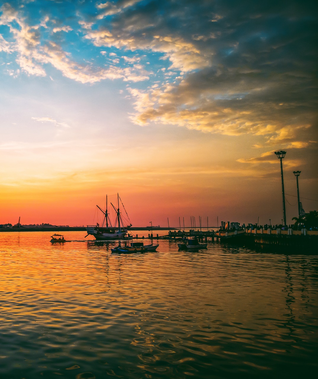 sunset  losari beach  sulawesi free photo