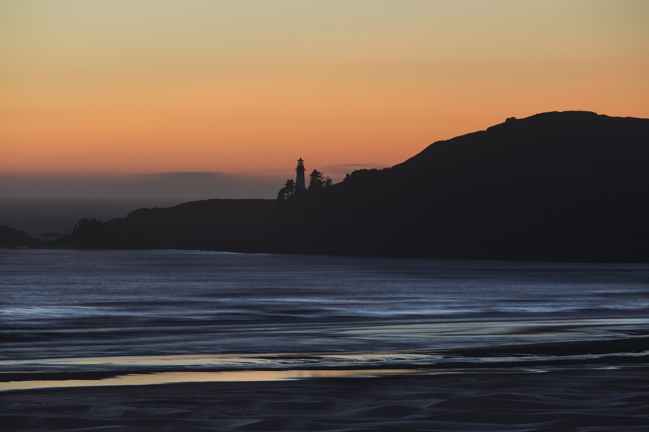 sunset  coast  lighthouse free photo