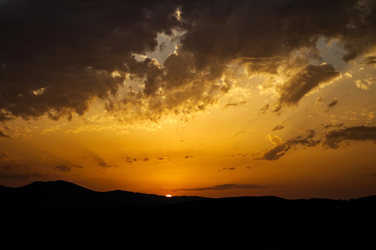 sunset  in the evening  the clouds free photo