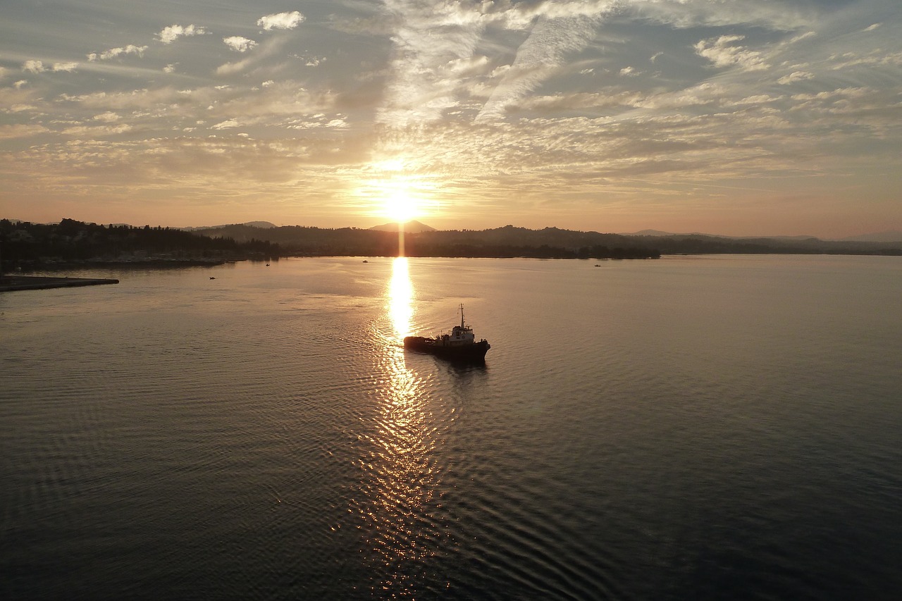 sunset  sea  boat free photo