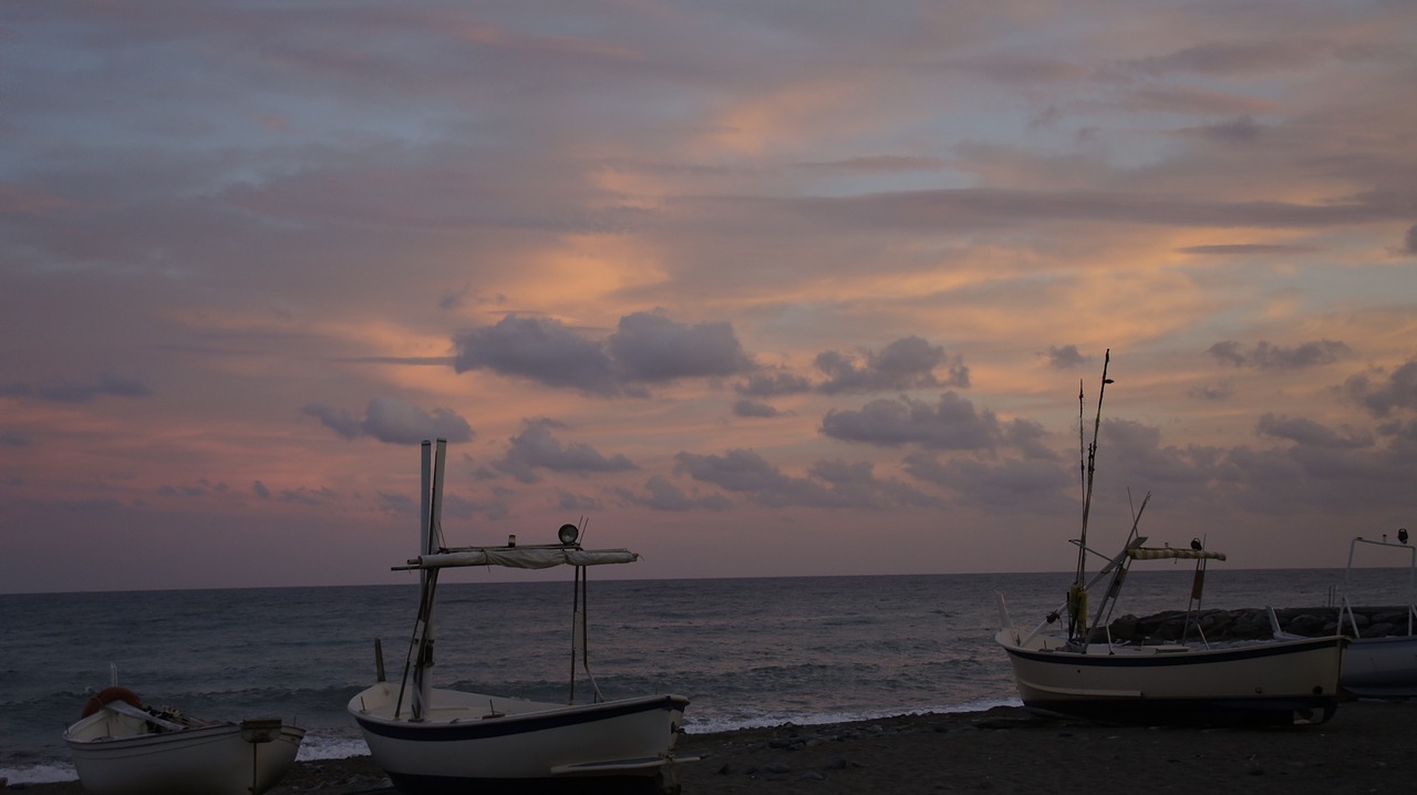 sunset  sea  boats free photo
