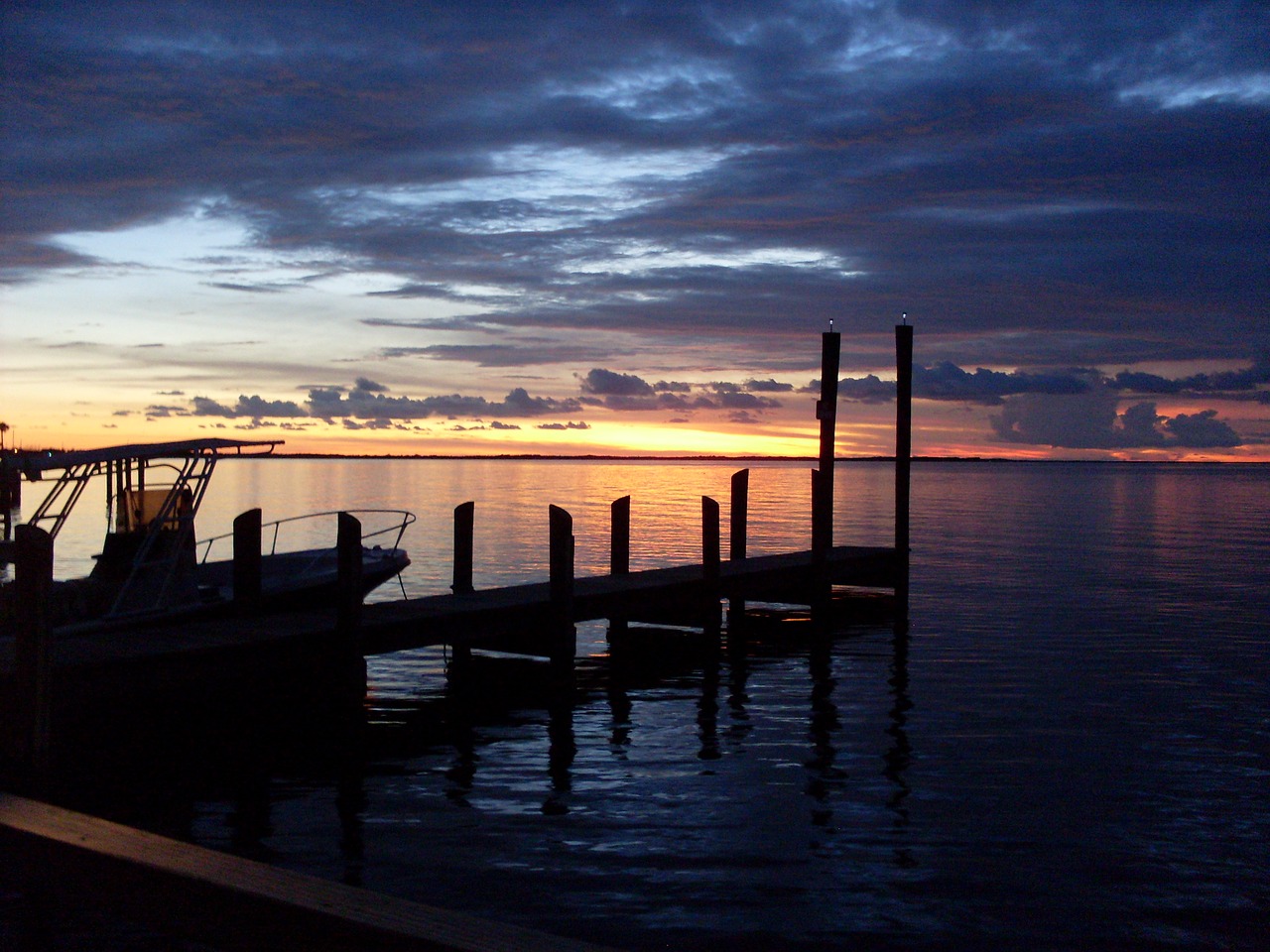 sunset  boat  sea free photo