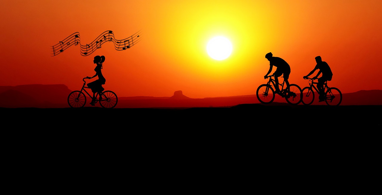 sunset  bicycles  woman free photo