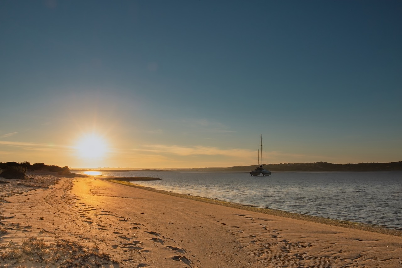 sunset  beach  boat free photo