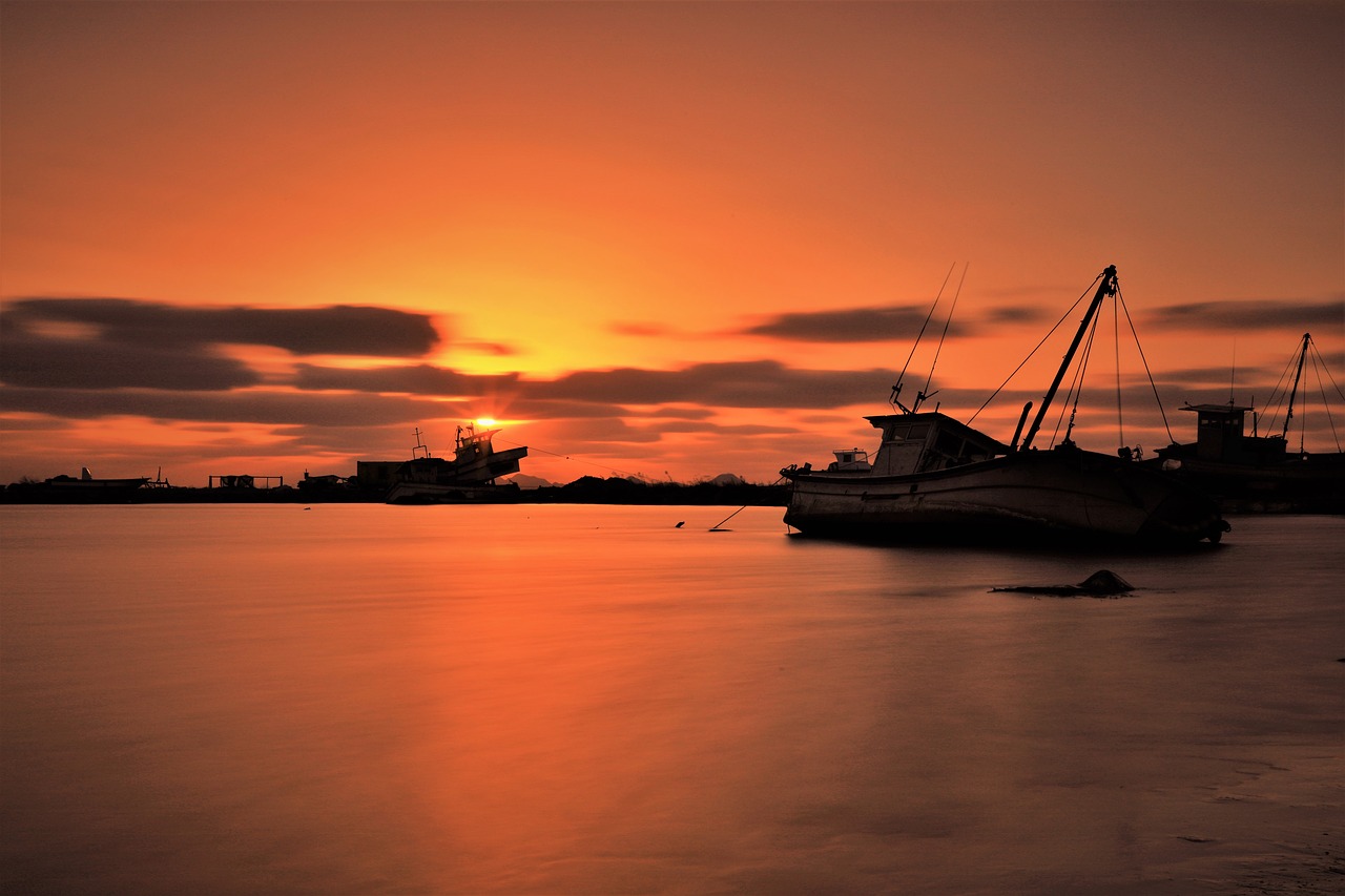 sunset  fishing boats  sea free photo