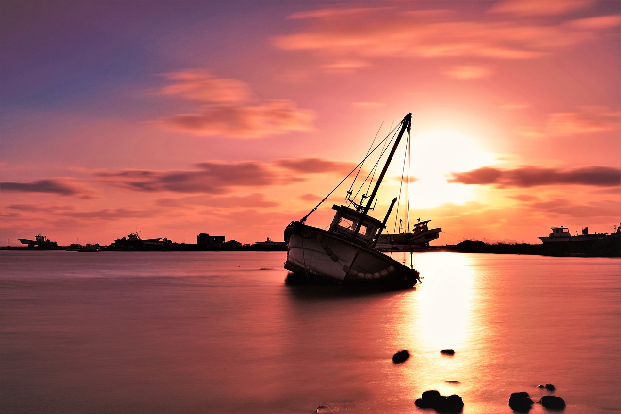 sunset  fishing boats  sea free photo