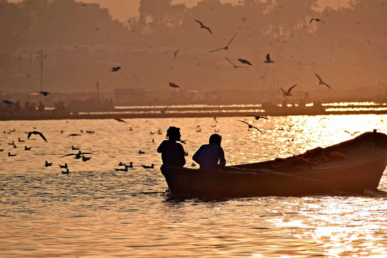 sunset  water  boat free photo