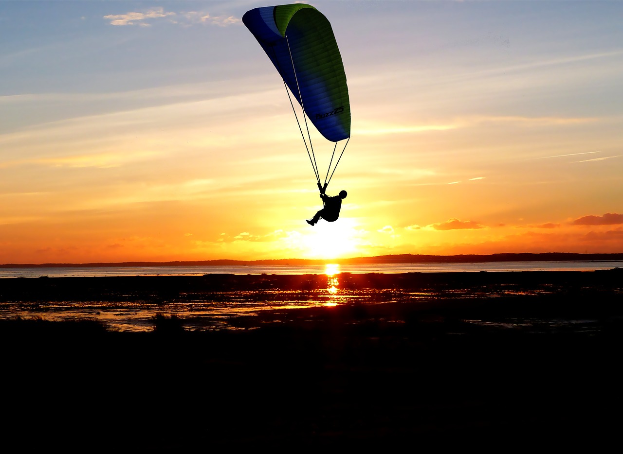 sunset  paragliding  sea free photo