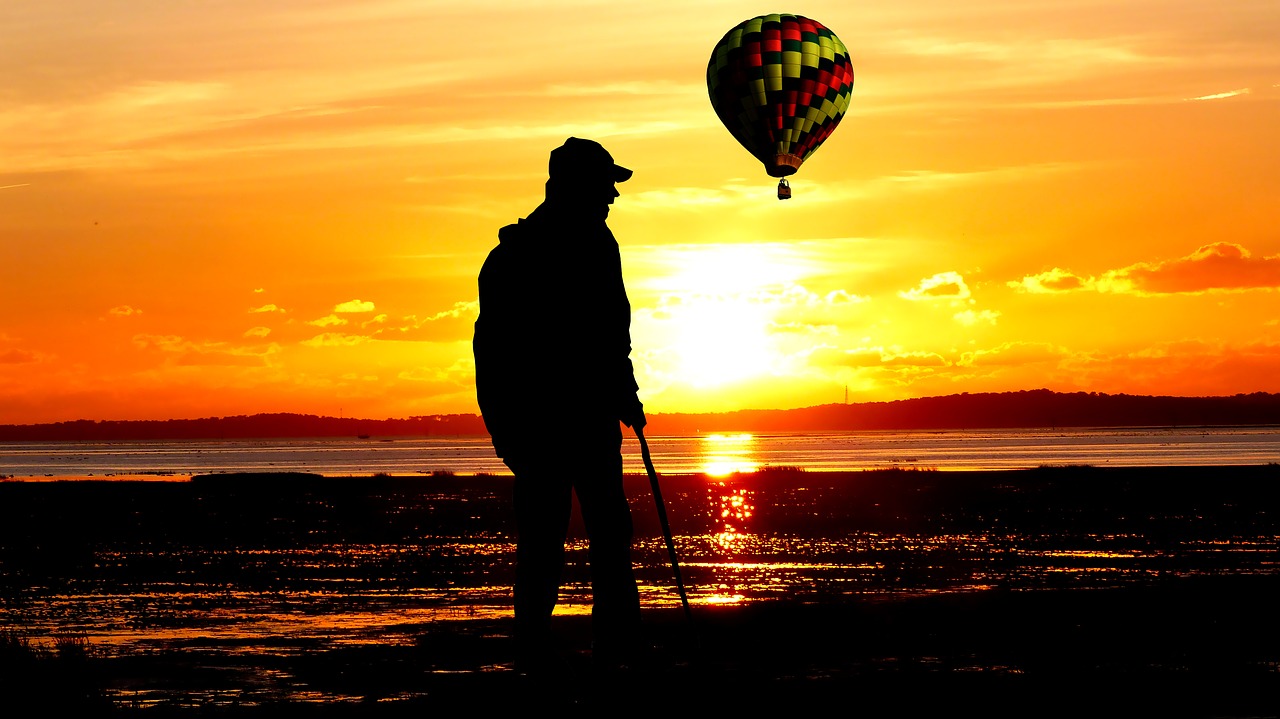 sunset  walker  hot air balloon free photo