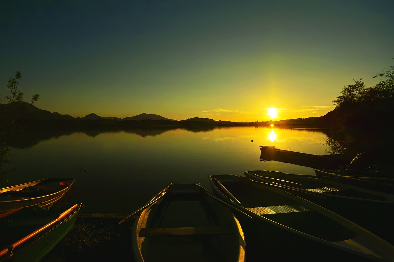 sunset  lake  boats free photo