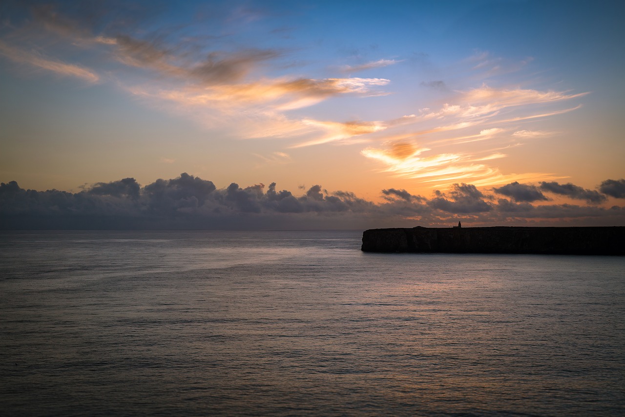 sunset  horizon  lighthouse free photo