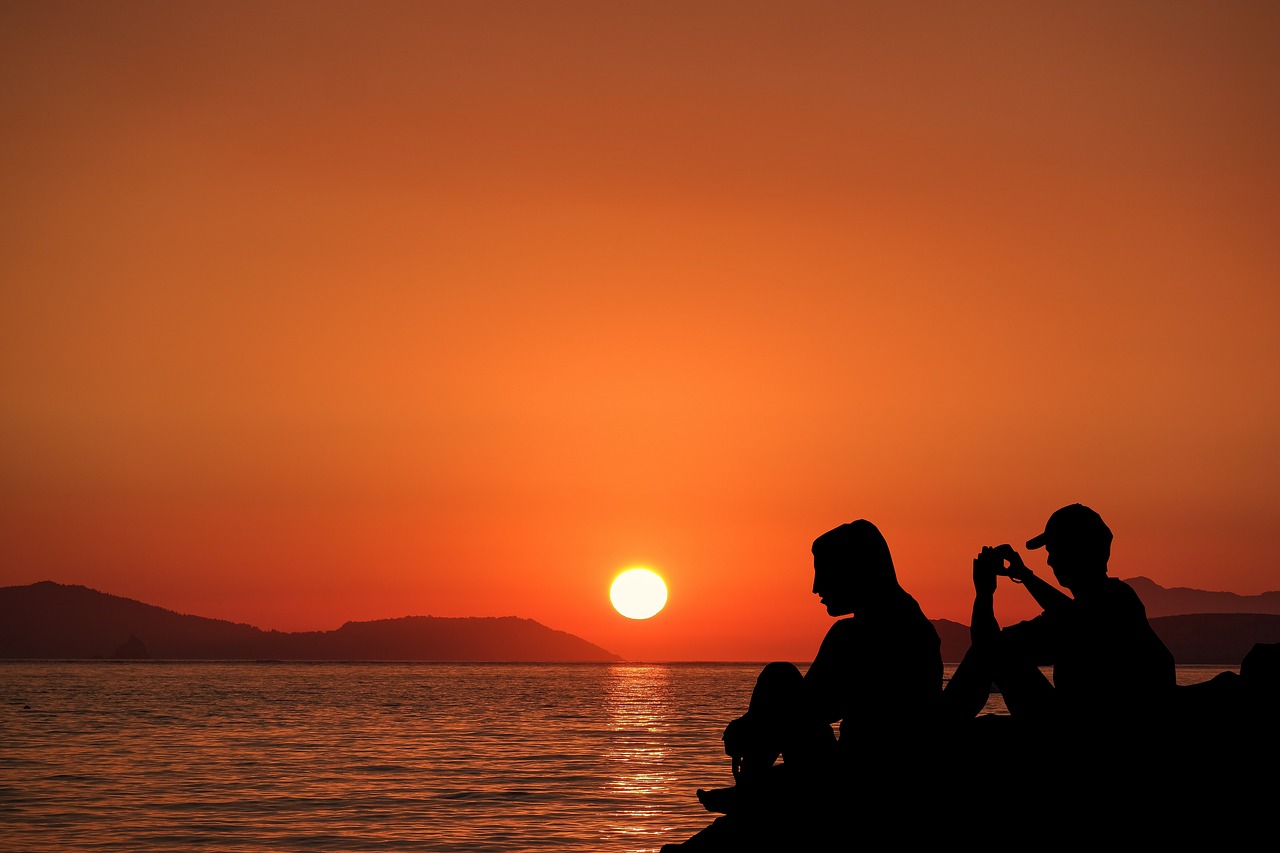 sunset  couple  romance free photo