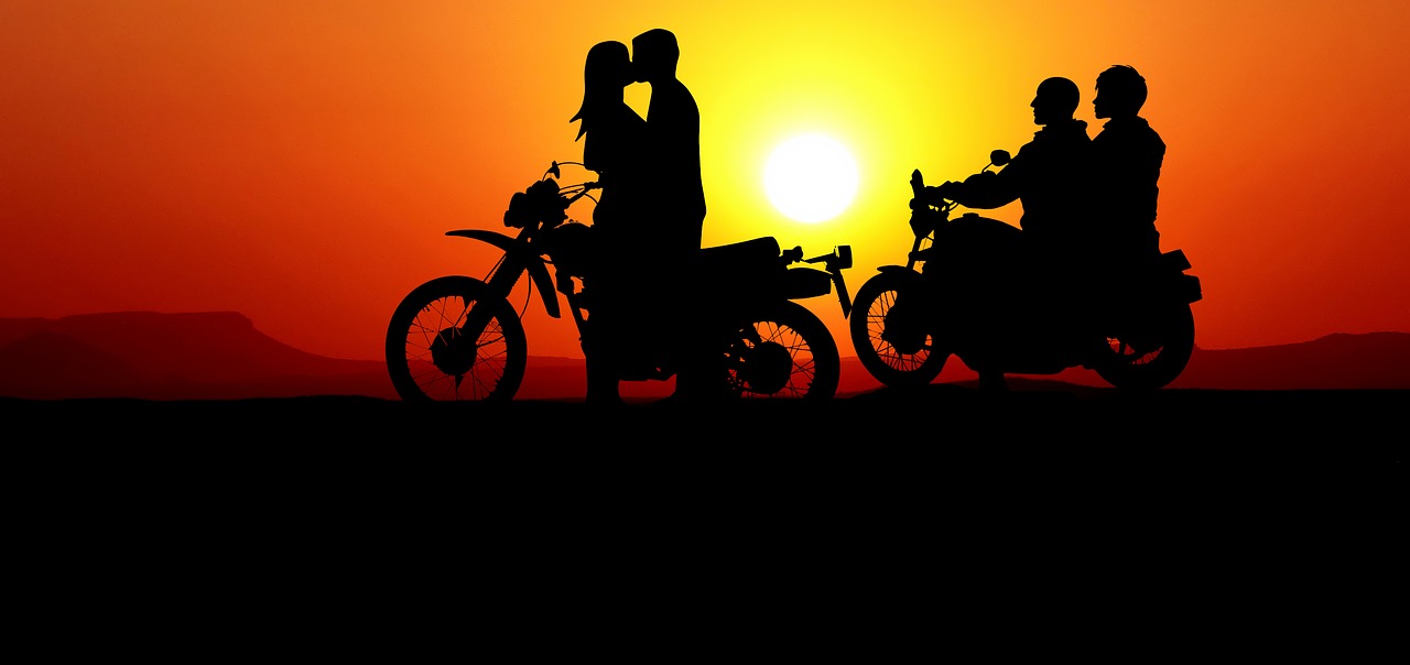 sunset  motorcycle  couple free photo