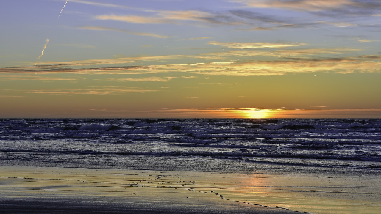 sunset  lithuania  beach free photo