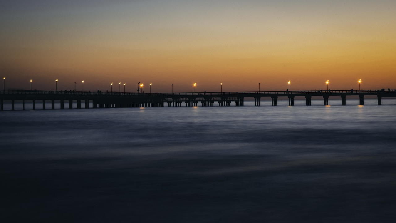 sunset  bridge  sea free photo