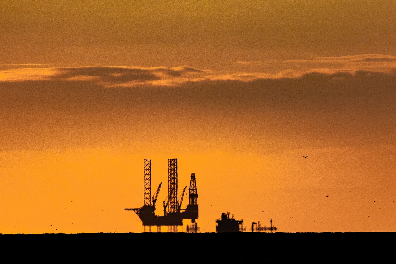 sunset  oil rig  north sea free photo