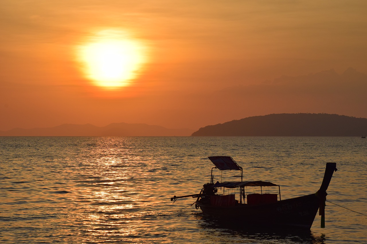 sunset  boat  sea free photo