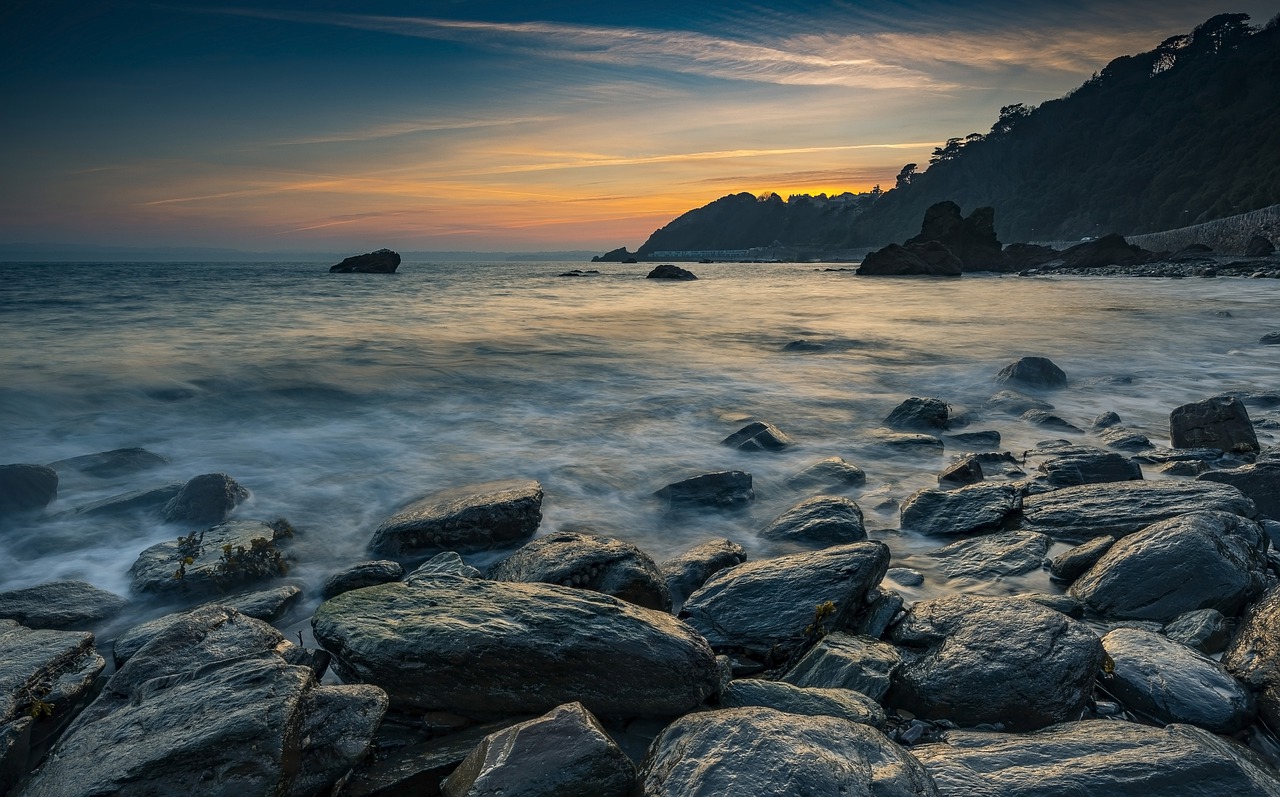 sunset  beach  rocks free photo