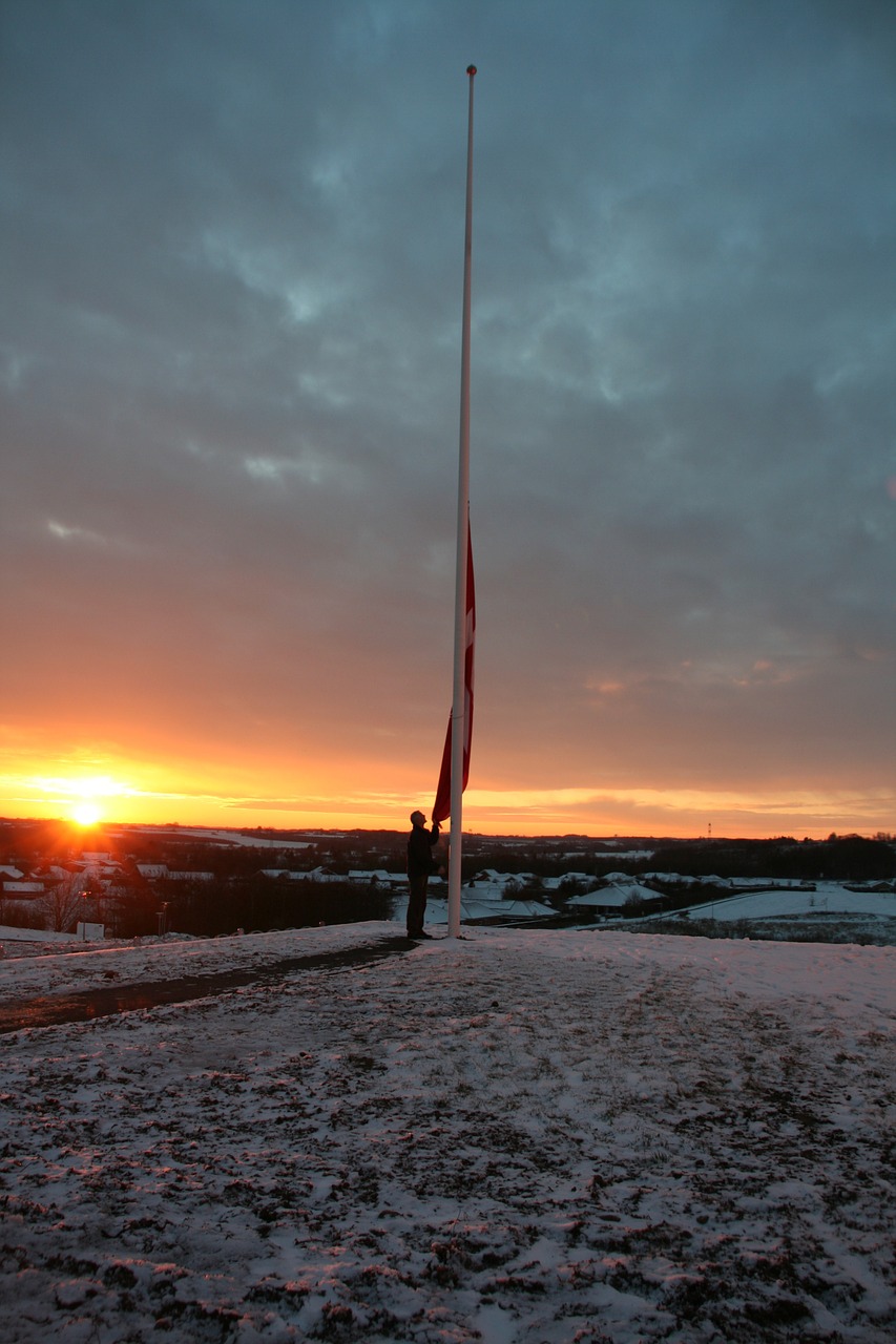 sunset flagpole snow free photo