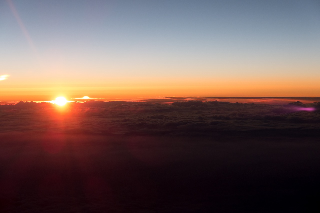 sunset above the clouds aircraft free photo