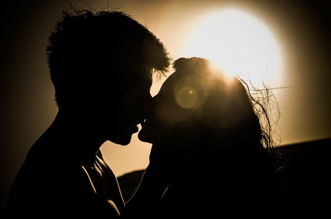 sunset kiss couple free photo