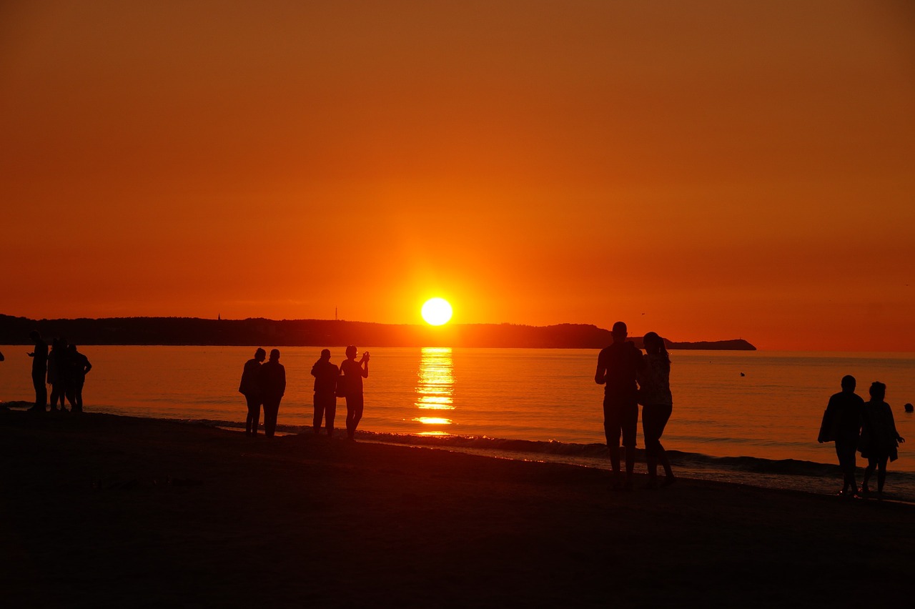 sunset people on the beach beach free photo