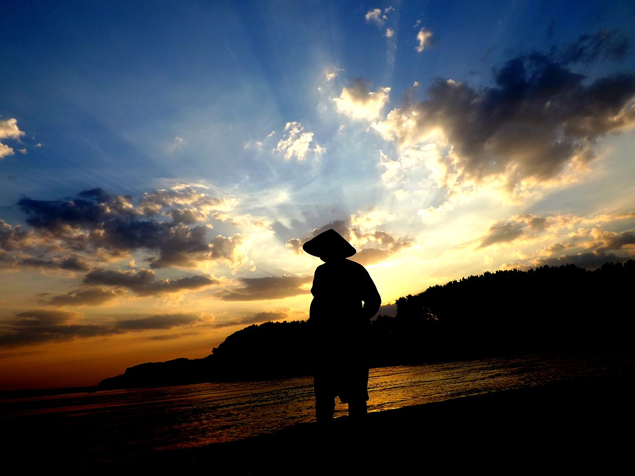 sunset fisherman water free photo