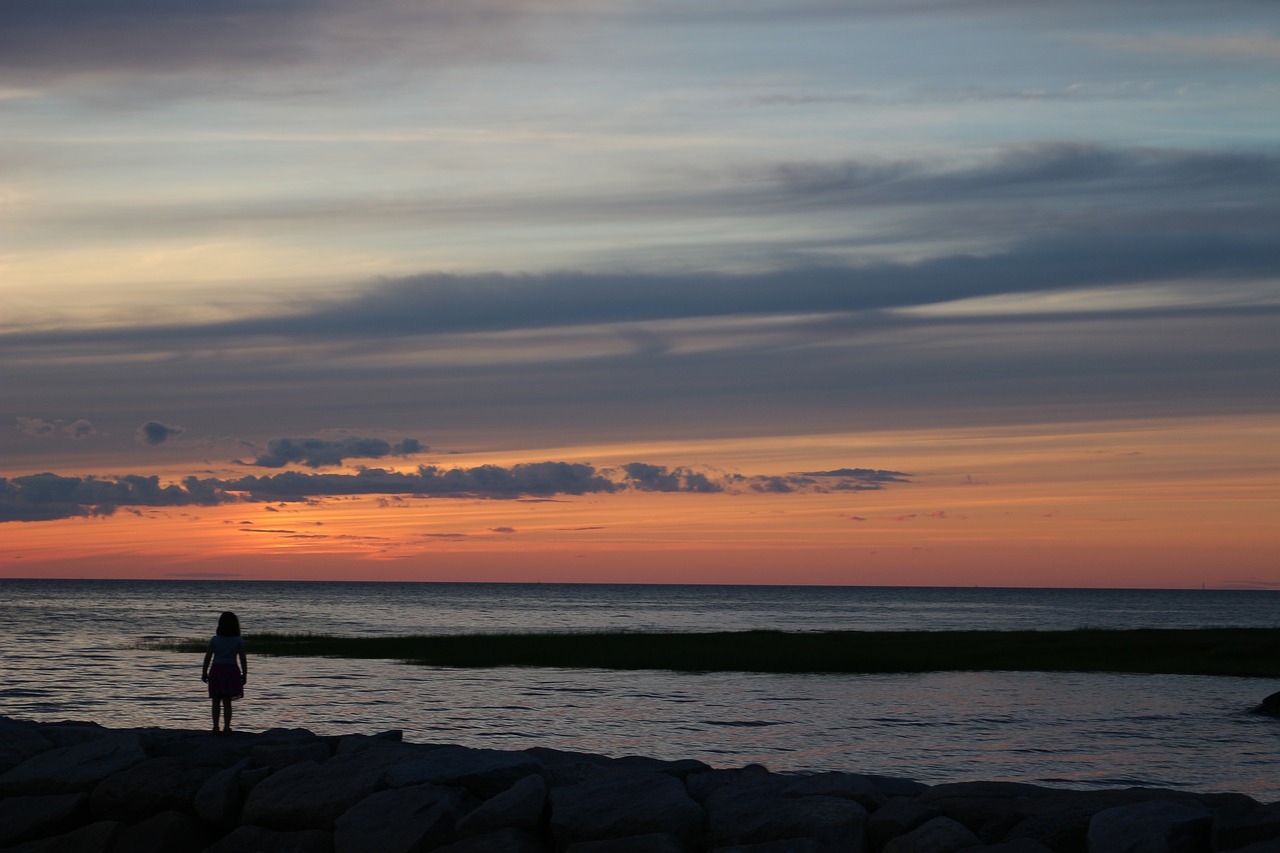 sunset over beach girl watching sunset over beach summer free photo