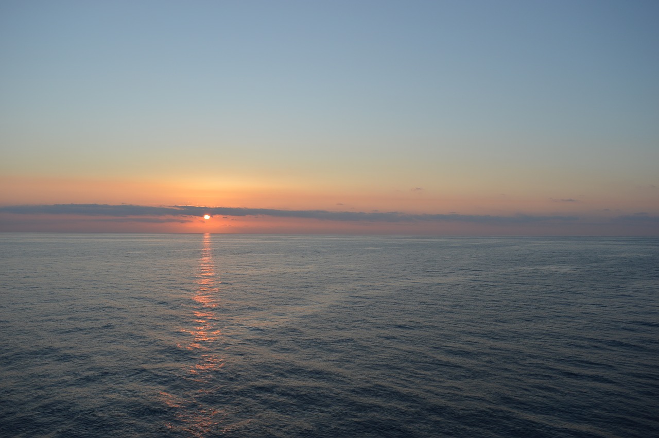 sunset over the sea sea sunset free photo