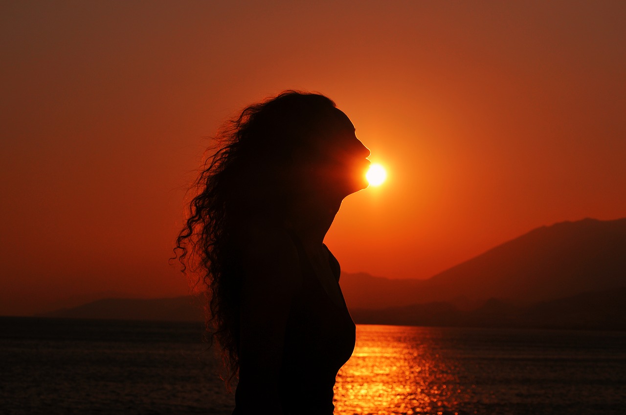 sunset silhouette kissing the sun curly girl free photo