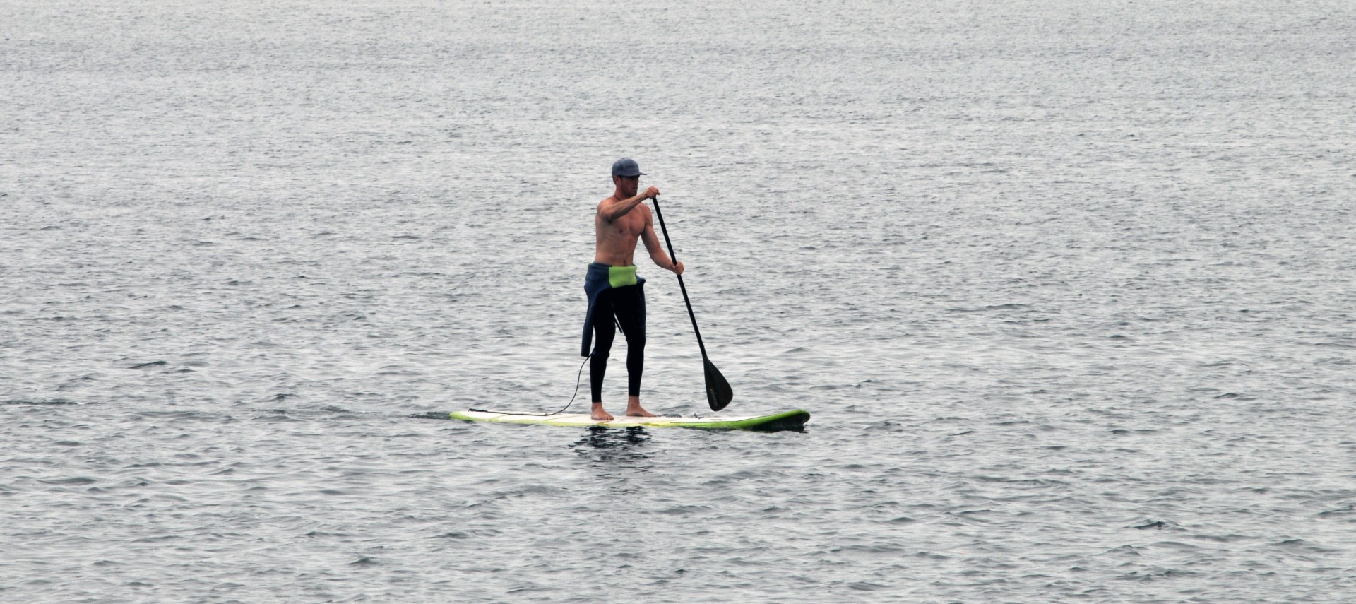 man surfboard paddling free photo