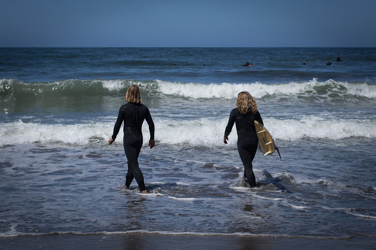 surfers woman waves free photo