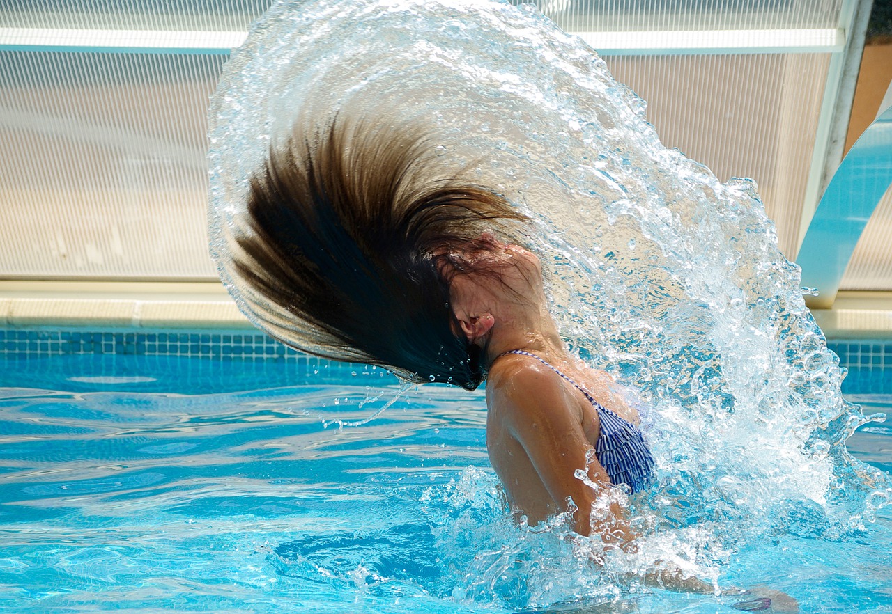 swimming pool drops of water black hair free photo