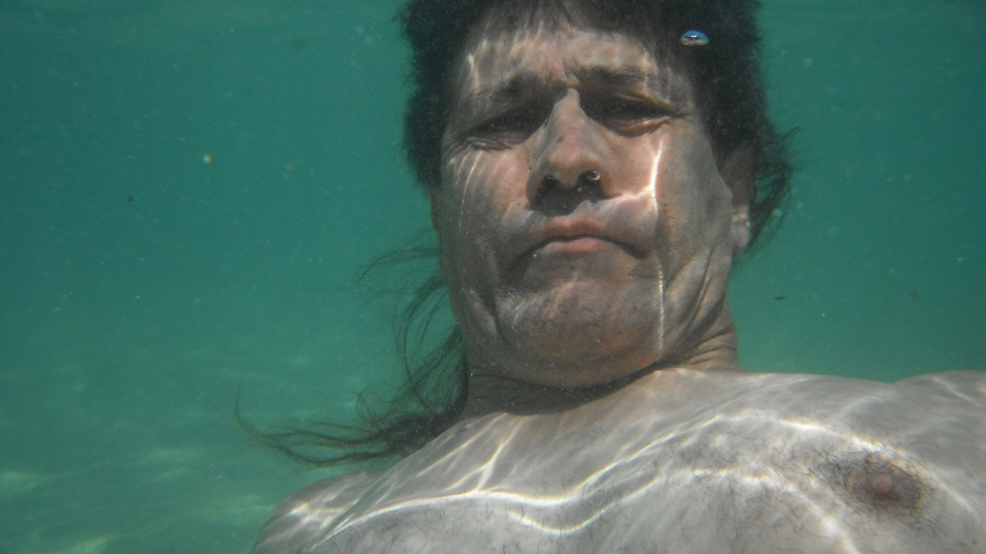 underwater swimming man free photo