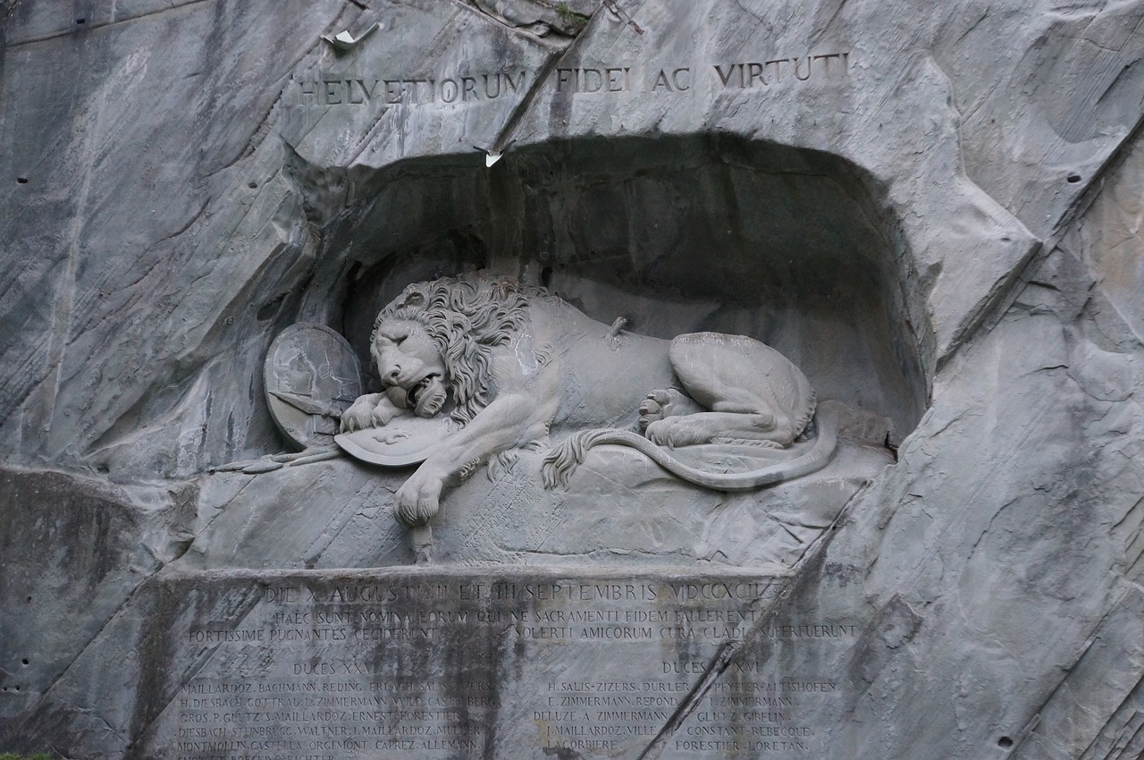 switzerland wounded lion stone carving free photo