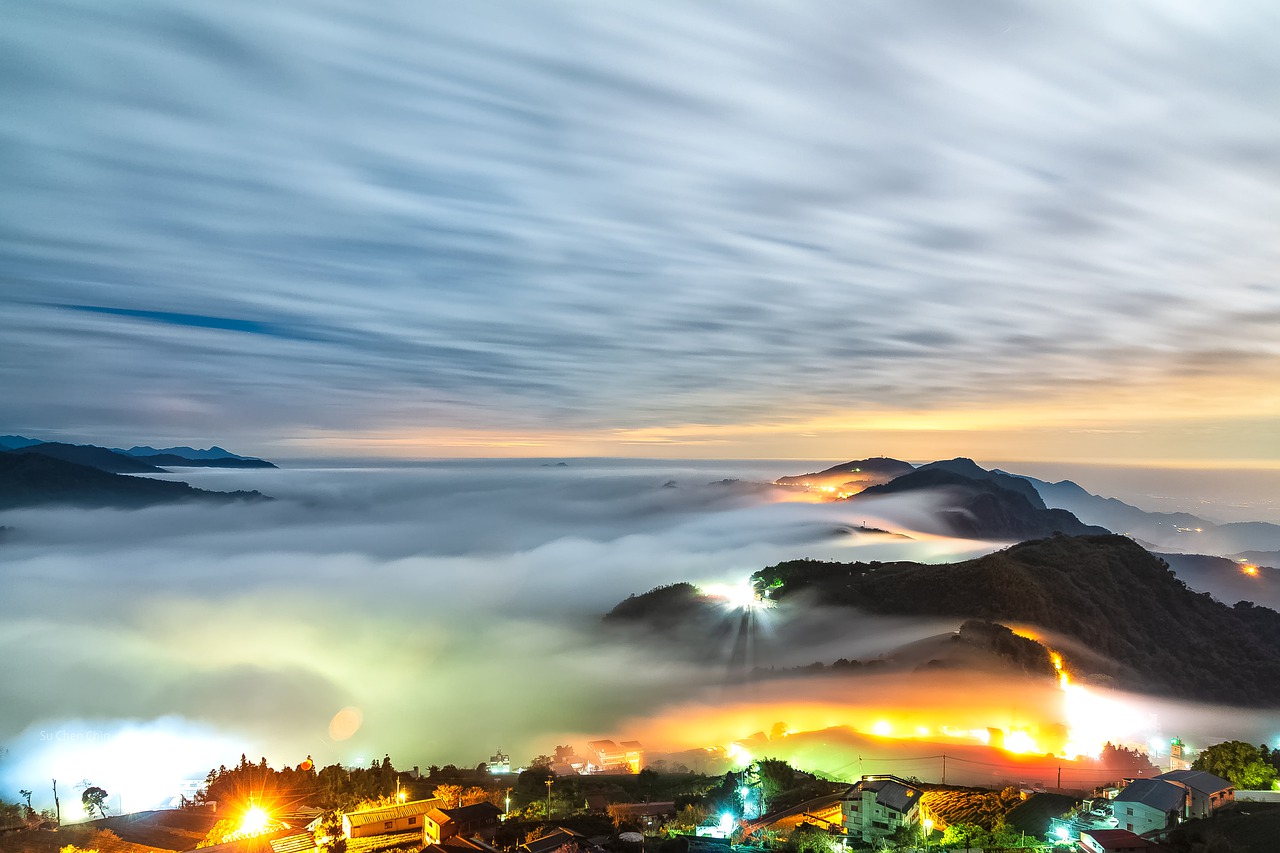 taiwan top stone table and a sea of clouds  night view  coloured light sea of clouds free photo