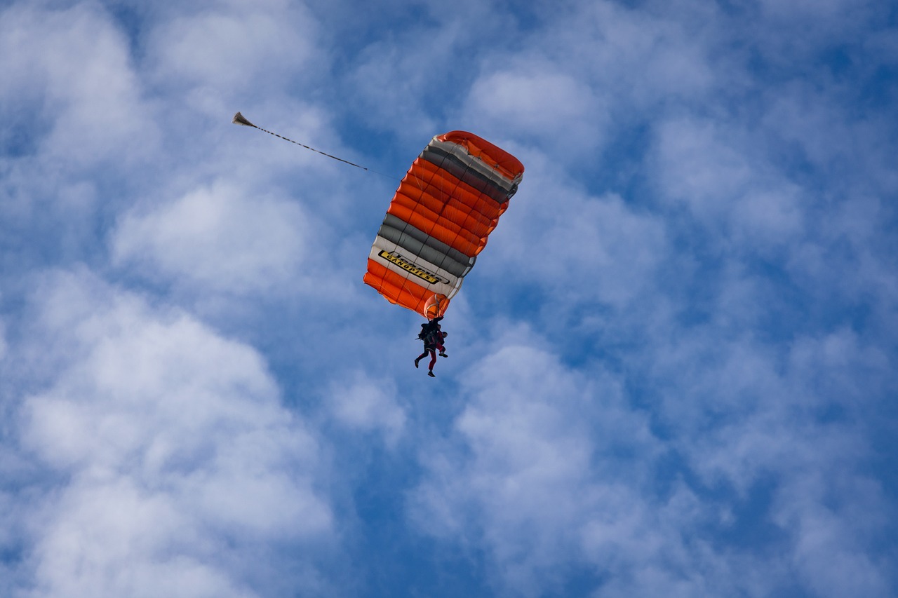 tandem jump parachute clouds free photo