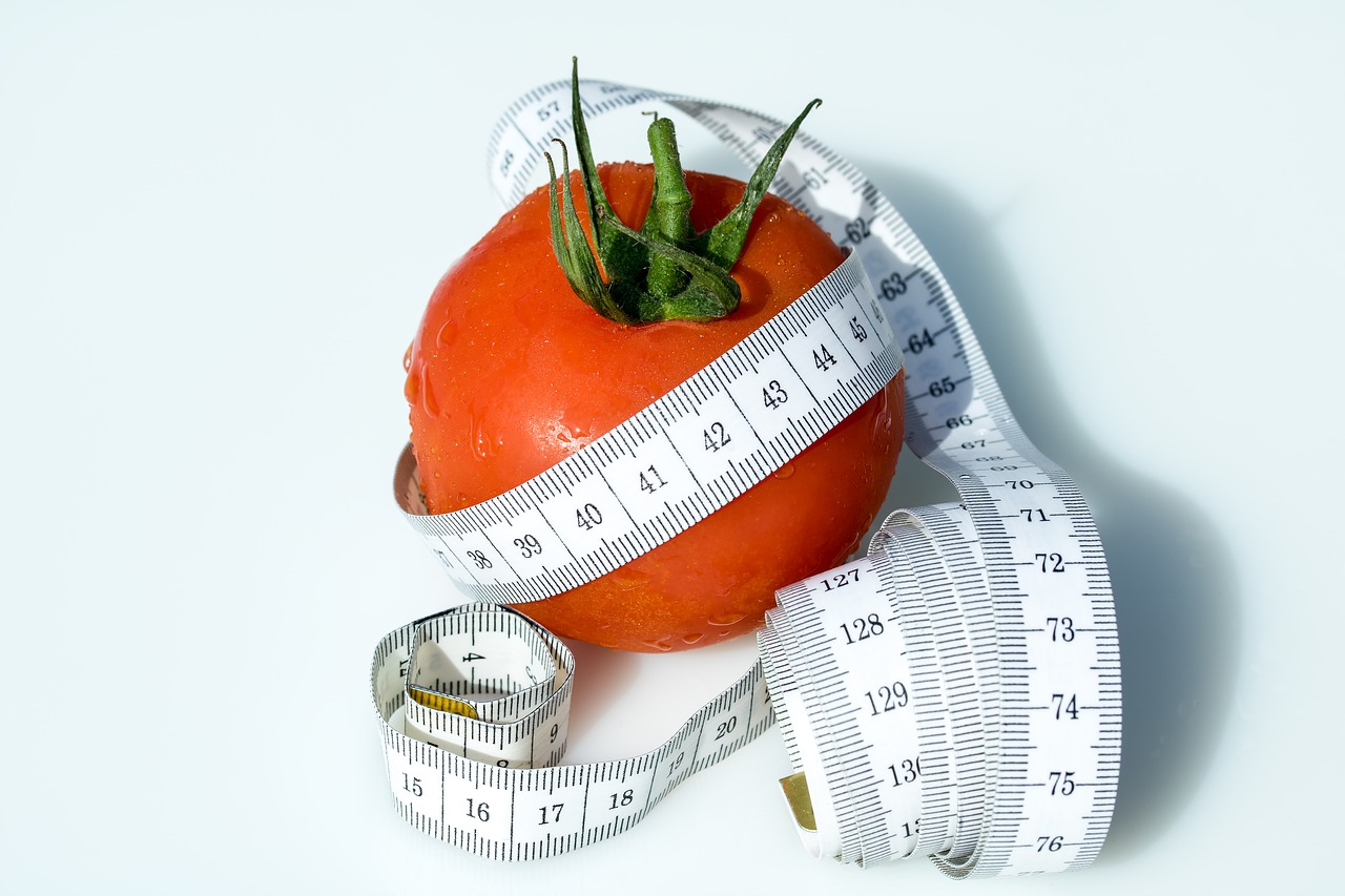 tape measure tomato wrapped up free photo