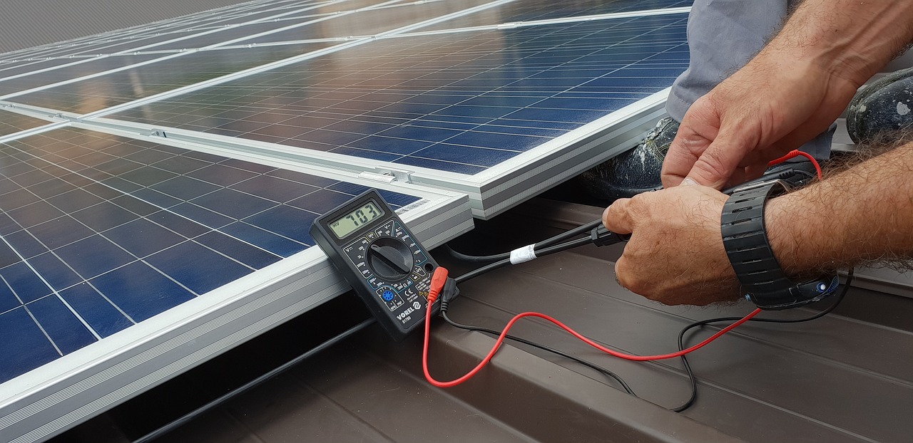 technician  solar panel  renewable free photo