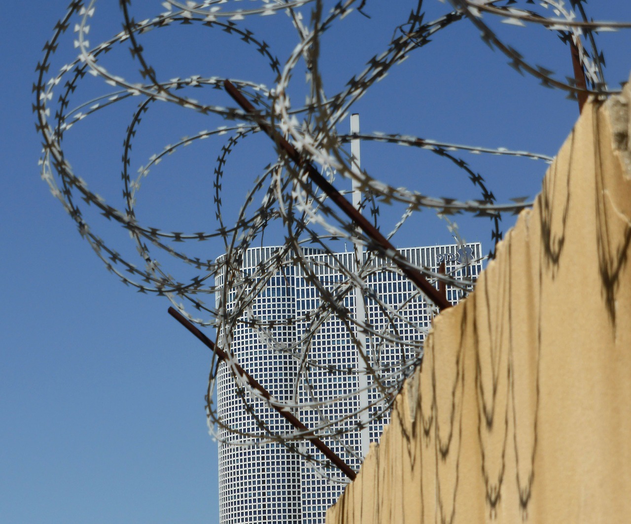 tel aviv skyscraper barbed wire free photo