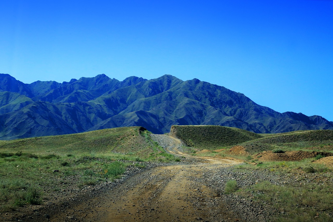 the dirt road mountain blue sky free photo