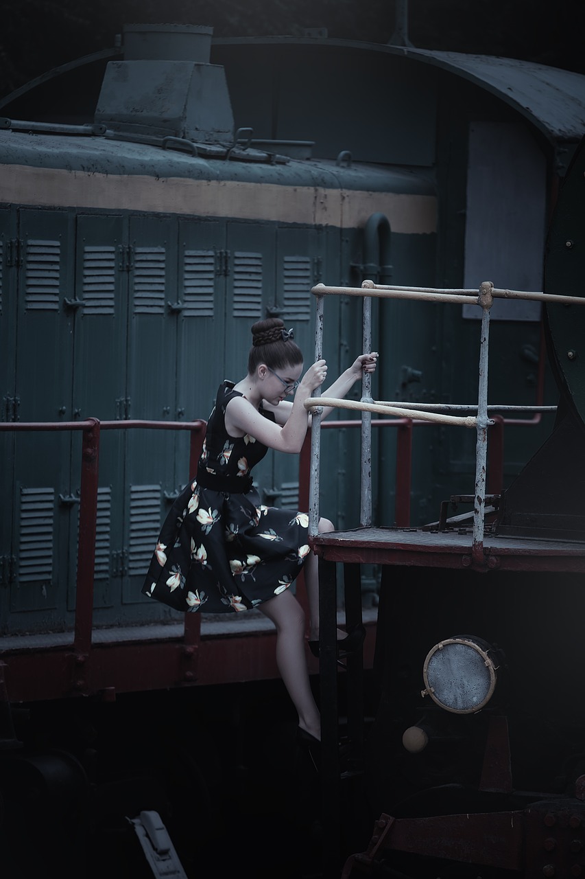 the girl in the train station steam locomotives retro free photo