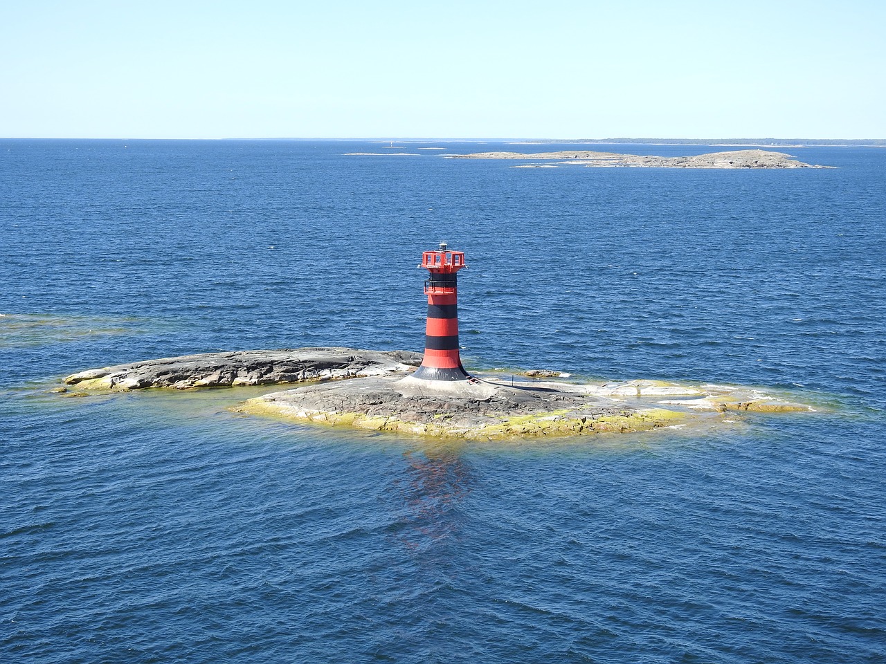 the lighthouse  sea  water free photo