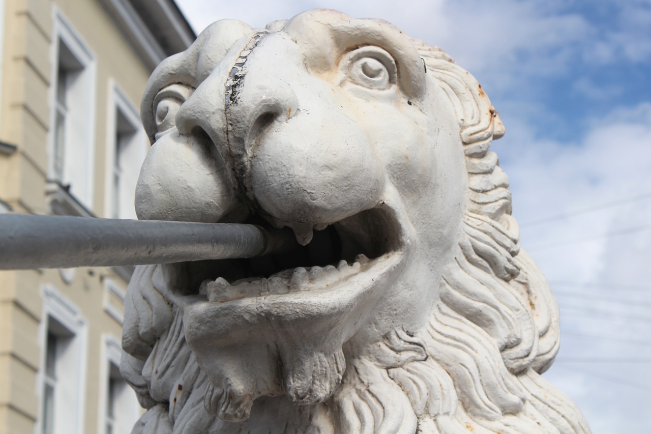 the lion  statue  cast iron free photo