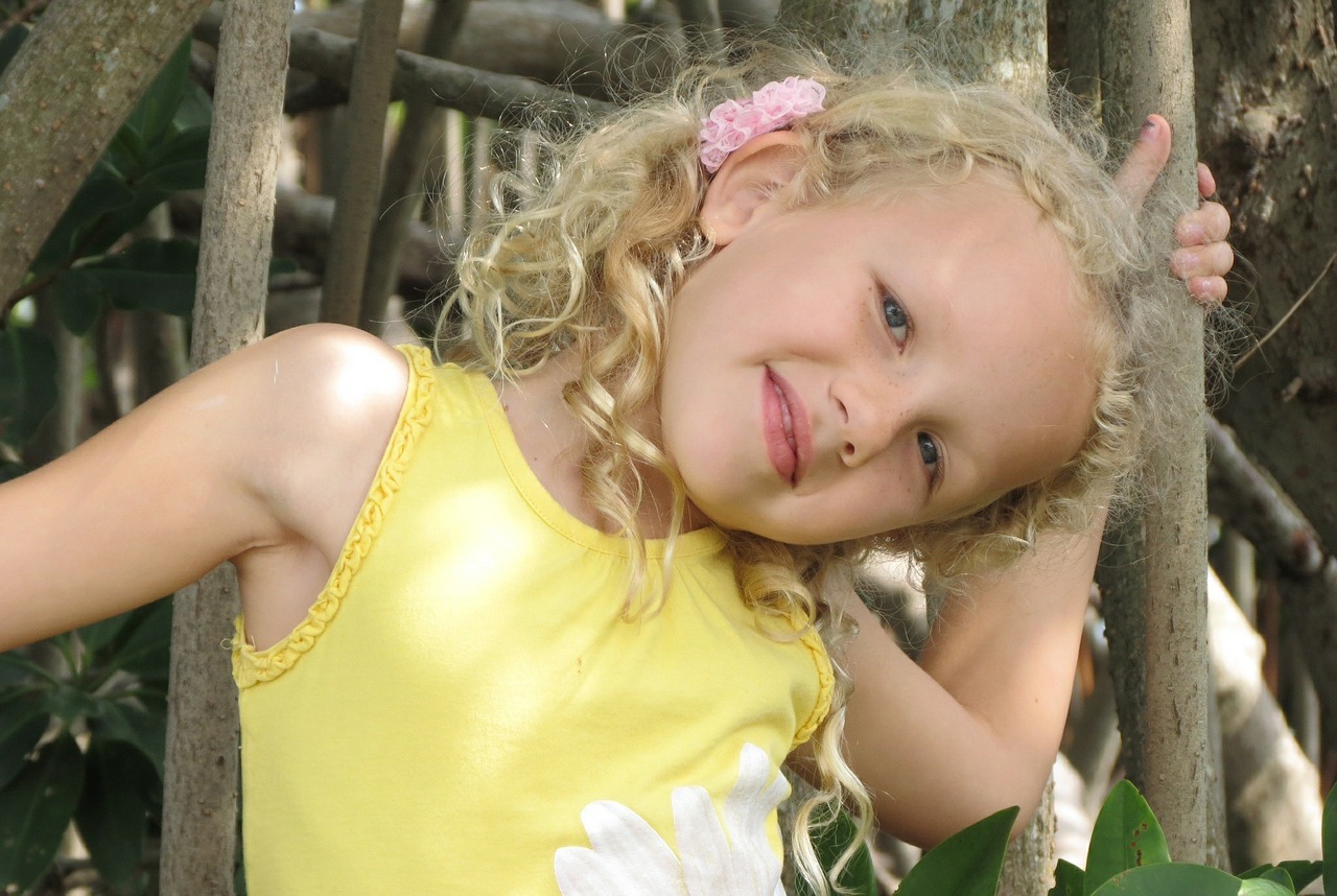 the little girl a smile yellow blouse free photo