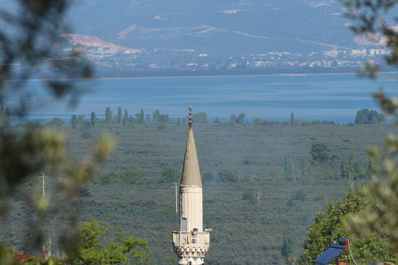 the minaret of the mosque  lake  village of soloz free photo