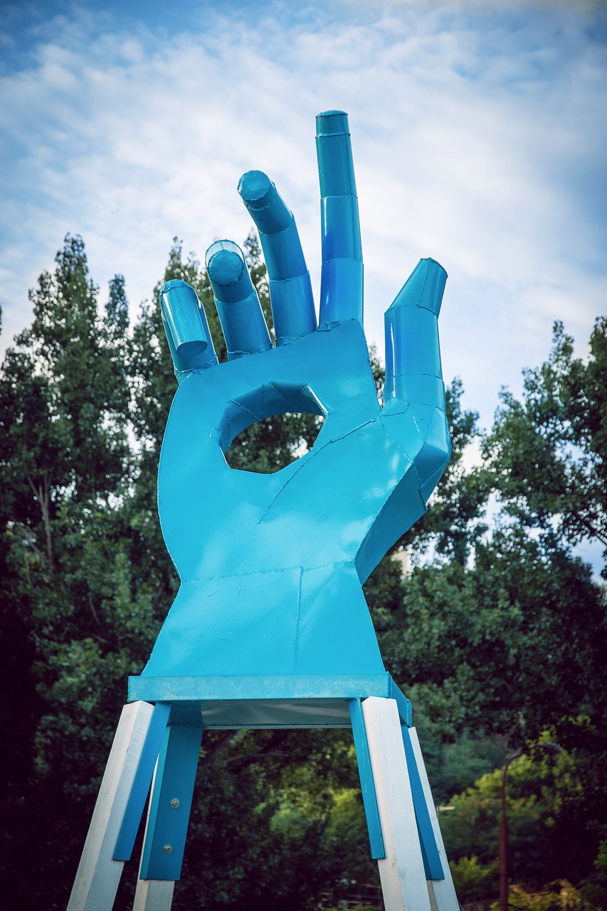 the statue of hand blue free photo