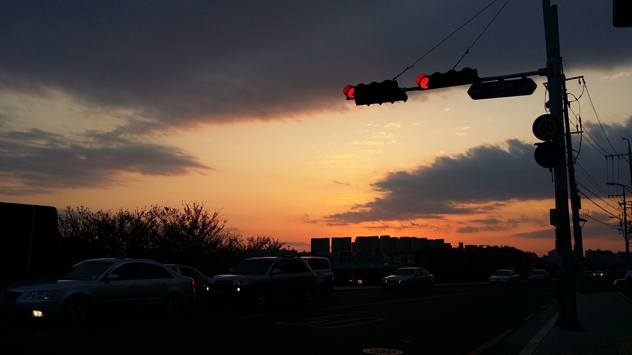 the traffic light glow in the evening free photo