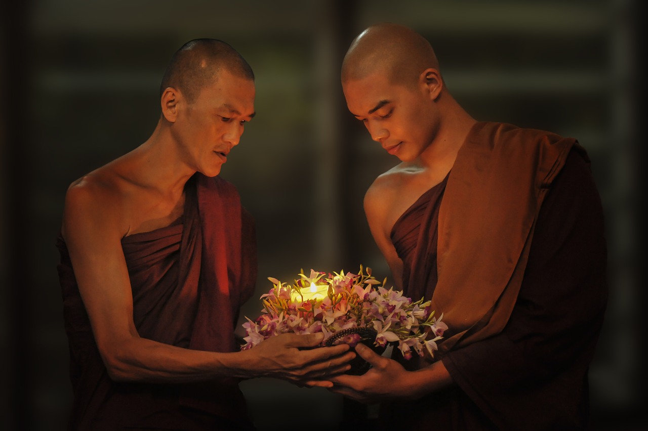 theravada buddhism monks passing candle free photo